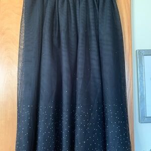 A New Day black skirt with a mesh overlay with a black lining